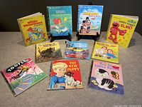 Overview of all 10 Little Golden Books arranged on a surface, showing titles and front covers.