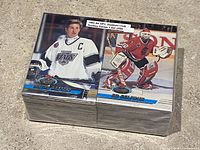 Complete 1993-1994 OPC Stadium Club Hockey Series One set stacked tightly, showing front cards featuring Wayne Gretzky (Los Angeles Kings) and Ed Belfour (Chicago Blackhawks)