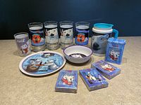 Full lot overview showing 5 glasses, plate, bowl, pitcher, and 3 decks of playing cards arranged on surface