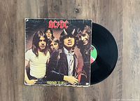 Front view of AC/DC Highway to Hell 1979 first pressing vinyl LP record with original jacket showing band members and album title.