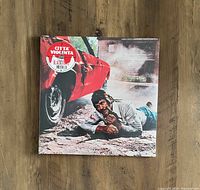 Front cover of sealed Citta Violenta 2LP vinyl record by Ennio Morricone showing man lying on street near red car under shrink wrap.