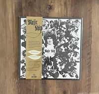 Photo of sealed Majic Ship LP vinyl record with psychedelic themed jacket and obi strip on wooden floor.