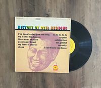Photo of Otis Redding vinyl record partially out of its original cover showing album artwork and label