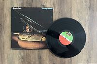 Photo of Roberta Flack Killing Me Softly vinyl LP record with its jacket. The record label is Atlantic Records and the cover shows Roberta Flack playing piano.