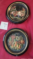 Framed Russian Legend plates front showing colorful mythological scenes in black and gold circular frames on a red surface with Mazsold lot tag.