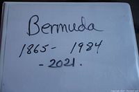 Photo of white binder album cover hand-labeled 'Bermuda 1865-1984-2021'