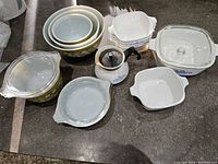 Overview of all Pyrex and CorningWare items arranged on countertop