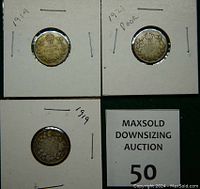 Reverse side of three Canadian silver dimes dated 1914, 1919, and 1921. The 1921 coin is marked as poor condition, crown and wreath design visible.