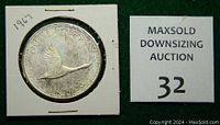 Reverse of the coin showing a flying goose in flight with inscriptions including the year 1967 and 'CANADA'.
