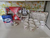 Full breakfast collection including butter dish with box, demitasse set, 8 china cups, serving tray, and linen place mats.