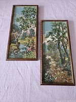 Pair of two framed needlepoint landscape artworks on fabric, showing full view of lot.