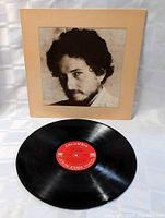 Photo of the vinyl record LP showing the red Columbia label and the record surface.