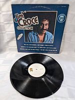 Front and back cover of the sleeve showing album title, artist, and song list.