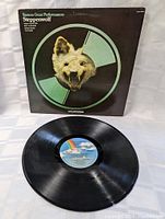 Front view of Steppenwolf LP vinyl record showing sleeve design with snarling animal head and record partially out of sleeve.