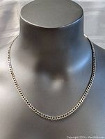 Front view of the sterling silver thick chain necklace displayed on mannequin bust showing clasp and chain thickness.
