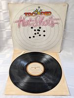 Vinyl record on white inner sleeve showing MCA Records label and vinyl condition