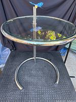 Full view of round glass top and chrome frame showing size and design.