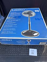 Box of Lasko multi-purpose pedestal fan showing product image, dimensions, and features on packaging.