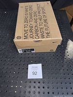 Box showing Nike branding and sustainability message 'Move to Zero is Nike's journey toward zero carbon and zero waste to help protect the future of sport'.