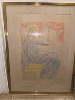 Full view of framed artwork showing figure in pastel colors under glass