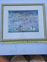 Close-up image showing frame details, measuring tape for size reference approximately 21.5" x 18".