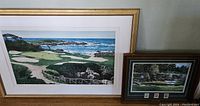 Two framed golf-themed artworks, larger print (left) and smaller framed with stamps (right) showing the set.