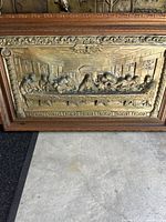 Full view of framed 3-D brass finish metal Last Supper artwork showing entire piece with wooden frame and detailed relief panel.