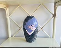 Full frontal view of the vintage lady head vase showing the colors, details, and overall shape on a white shelf.