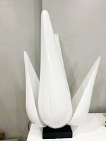 Front view of lamp showing all four petals and base