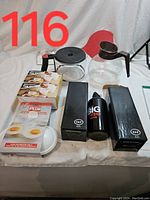 Overview of kitchen gadgets including coffee pots, water bottle, microwave egg cookers, and replacement knobs.