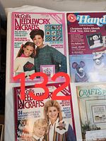 Two vintage McCall's Needlework & Crafts magazines and one Handicrafter magazine showing front covers with seasonal craft themes.