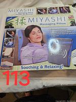 Front of Miyashi massage pillow box showing product features and uses