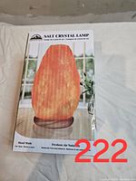 Box front showing the salt crystal lamp packaging with image of lamp and logo
