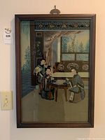 Full view of framed painting showing three women around a game board in interior setting