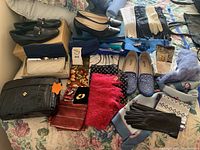 Overview of lot showing handbags, shoes, scarves and gloves on bed