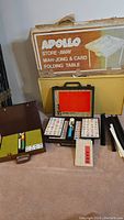 Entire lot including table packaging, mahjong set, card accessories