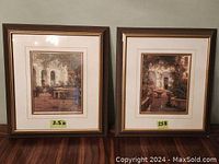 Two framed European patio prints side by side, wooden frames with golden inner trim and glass. Frame 25B has two chips.