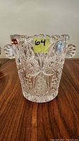 Front view of the Bleikristall crystal champagne bucket with two round handles and detailed cut patterns.