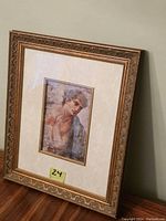 Photo of the framed print showing the entire wood frame, matting, and artwork inside.