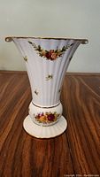 Front view of Royal Albert Old Country Roses Holiday vase showing fluted shape, floral pattern, and gold trim.