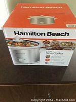 Box of Hamilton Beach 4 Quart Slow Cooker showing brand, size and image of product.
