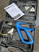 Complete set of Mastercraft heat gun in hard plastic case with four tips and manual.