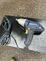 Clear photo of a Mastercraft electric impact driver showing entire tool including cord, body, and impact bit holder.