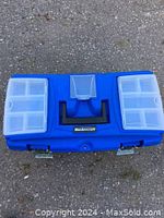 Top view of closed blue plastic Mastercraft toolbox with handle and two latches