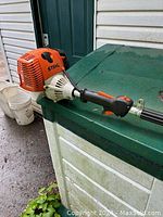 Side view of Stihl FS 90 R powerhead and straight shaft