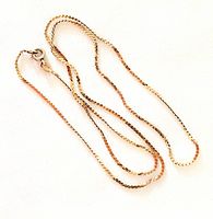 Photo of the chain laid flat showing its full length and clasp.