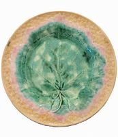 Top view of the Antique Griffin Smith & Hill green leaf Etruscan majolica plate showing the raised leaf pattern and colored glaze finish.