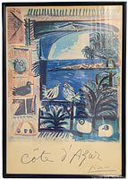 Front view of the framed lithograph showing coastal scene and frame