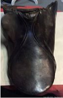 Top view of the black leather equestrian saddle showing wear and used condition.