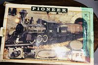 Box front showing vintage 1995 Pioneer Authenticated Railroad train set model No.180 with image of steam locomotive and background tunnel.